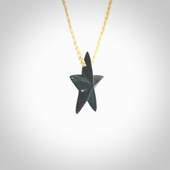 Hand carved black jade star pendant. Hand made black jade star pendant with adjustable cord.