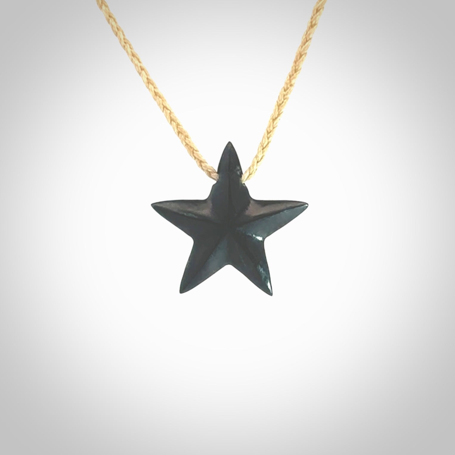 Hand carved black jade star pendant. Hand made black jade star pendant with adjustable cord.