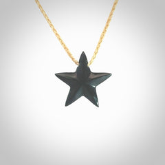 Hand carved black jade star pendant. Hand made black jade star pendant with adjustable cord.