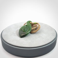 Ross Crump twist with koru pendant. Hand carved from rare New Zealand jade this is a beautiful pounamu pendant. The cord is length adjustable.