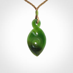 Ross Crump twist with koru pendant. Hand carved from rare New Zealand jade this is a beautiful pounamu pendant. The cord is length adjustable.