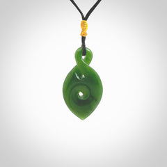 Ross Crump twist with koru pendant. Hand carved from rare New Zealand jade this is a beautiful pounamu pendant. The cord is hand plaited and is length adjustable. It has a little spiral floret popper at the top of the pendant. It is a delicate and very beautiful greenstone pendant. For sale online by NZ Pacific.