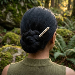 Woman wearing bone hair pin