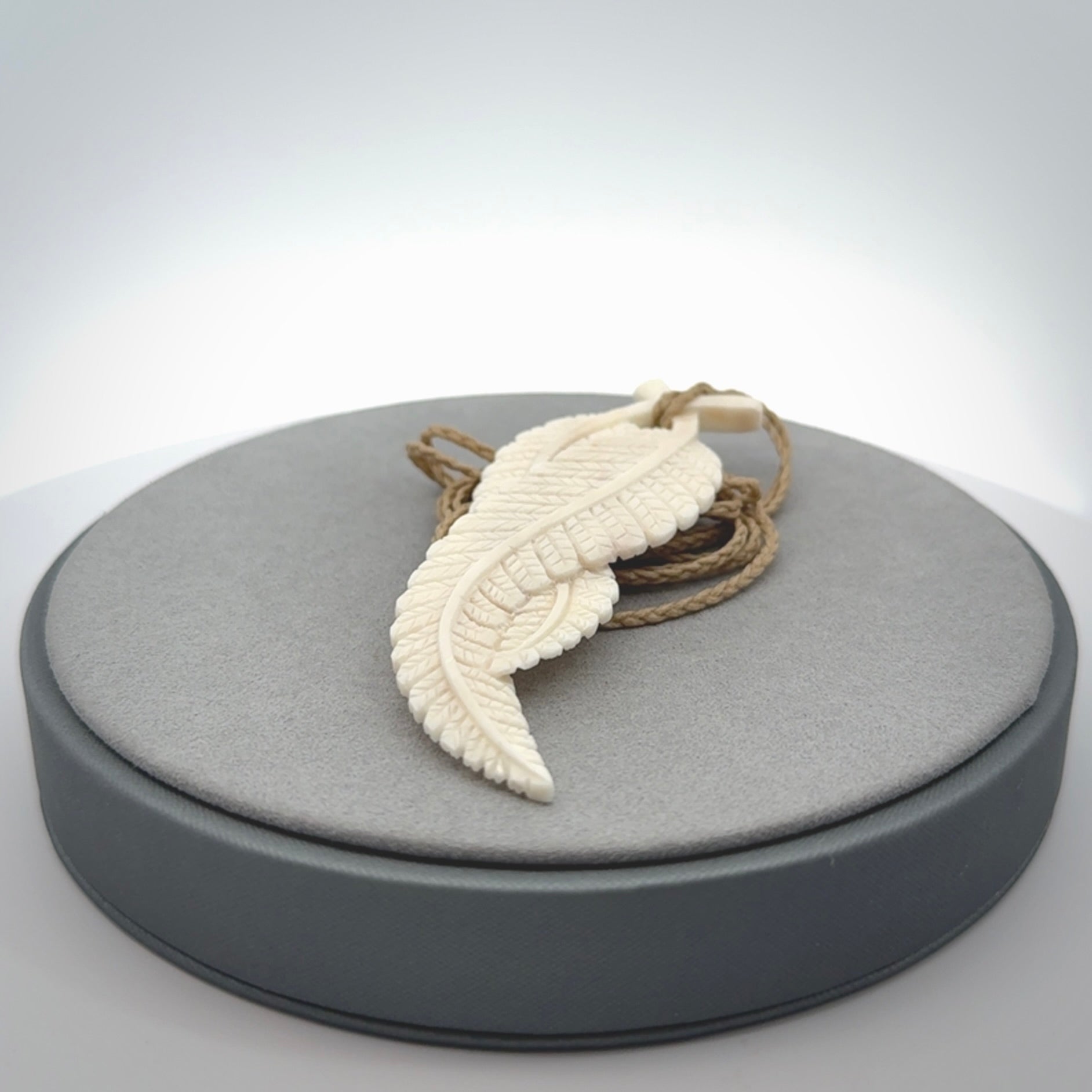 A hand carved large bone double fern leaf necklace. A beautiful large double fern leaf pendant carved from bone for NZ Pacific. This is a true piece of wearable art and is provided with an adjustable cord.