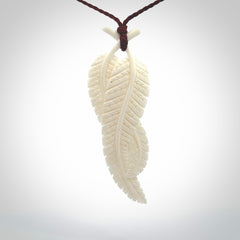 A hand carved large bone double fern leaf necklace. A beautiful large double fern leaf pendant carved from bone for NZ Pacific. This is a true piece of wearable art and is provided with an adjustable cord.