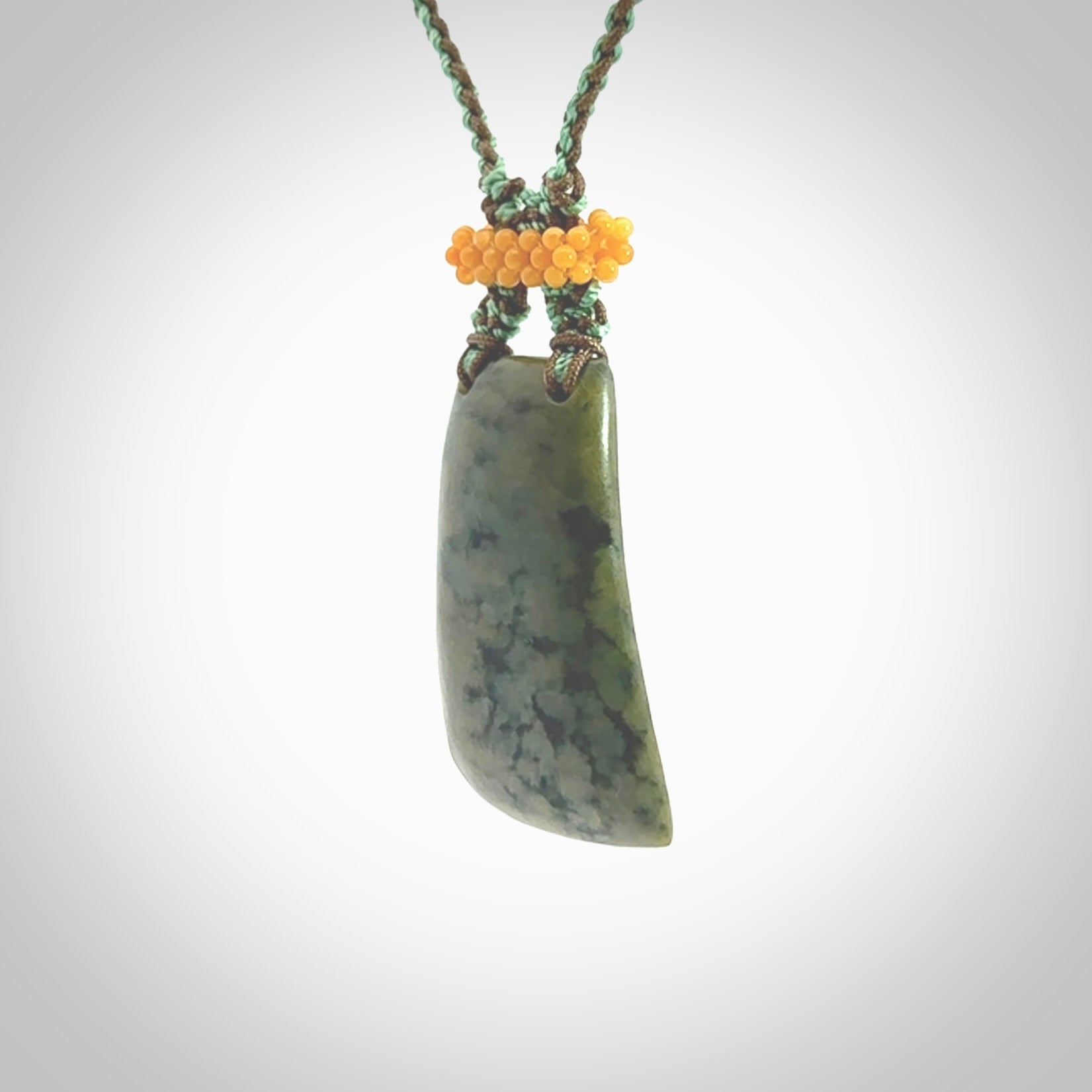 Hand carved New Zealand Jade pendant with adjustable cord. This piece is a stand out work of creativity and skill and we love Jen Hung's creations. Unique, one only, New Zealand made necklace for sale. Free shipping worldwide.
