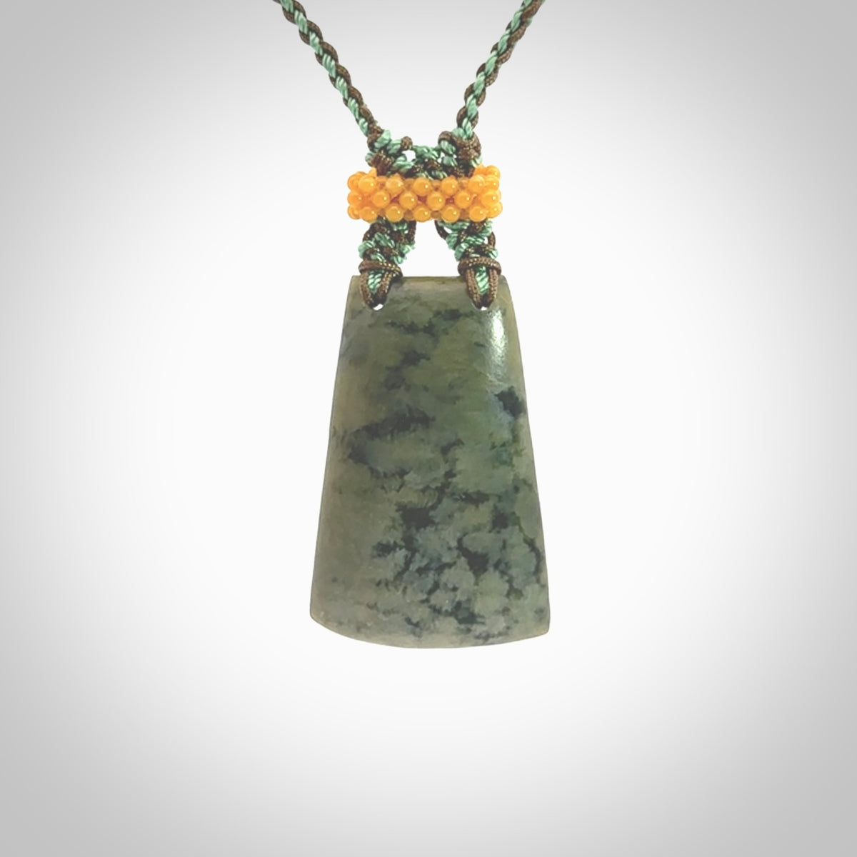 Hand carved New Zealand Jade pendant with adjustable cord. This piece is a stand out work of creativity and skill and we love Jen Hung's creations. Unique, one only, New Zealand made necklace for sale. Free shipping worldwide.
