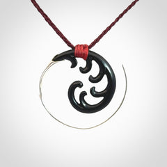 Hand carved pendant made from black jade with sterling silver. NZ Pacific contemporary Koru pendant for sale online.