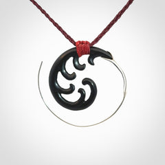 Hand carved pendant made from black jade with sterling silver. NZ Pacific contemporary Koru pendant for sale online.
