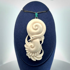 Hand carved bone swan pendant