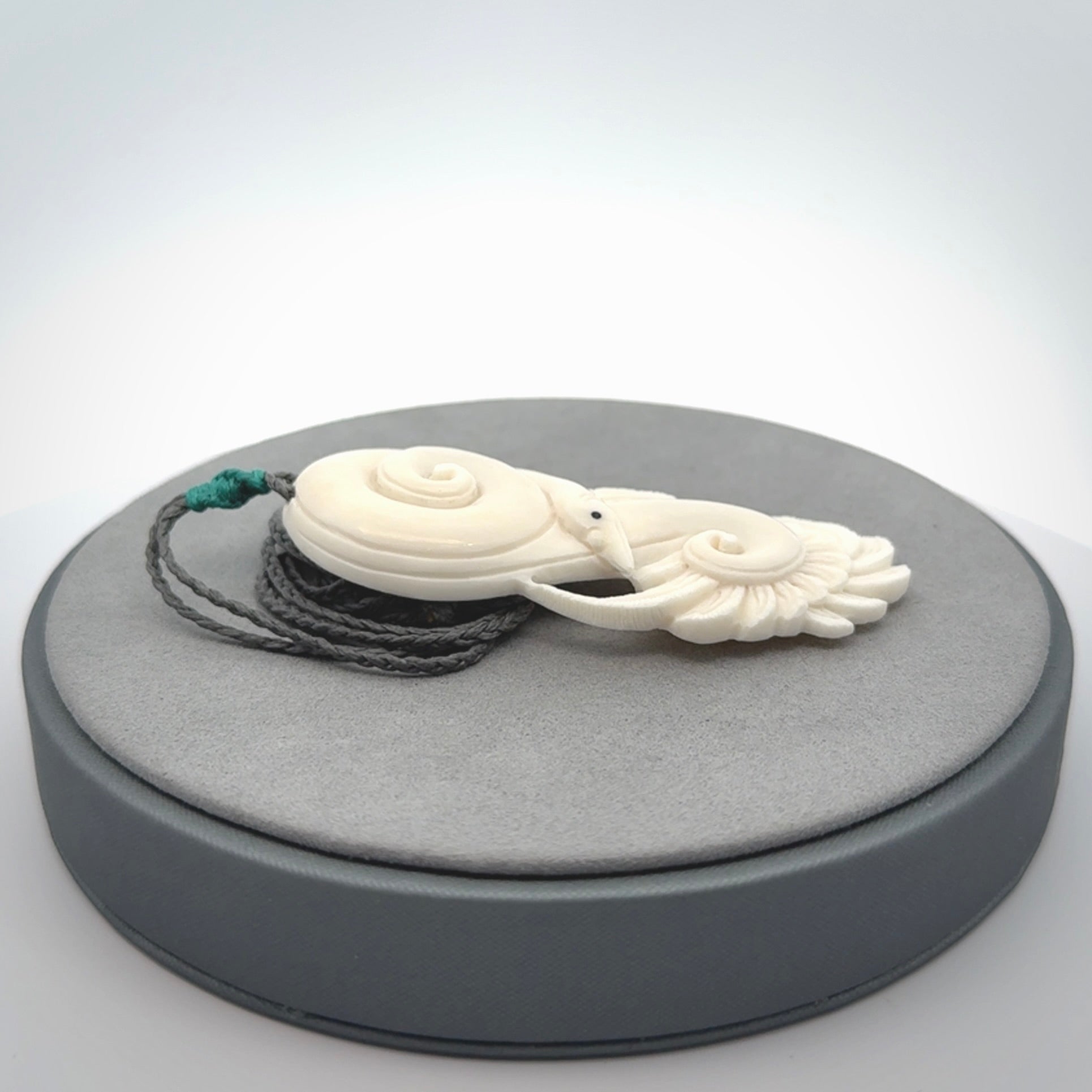 Hand carved bone swan pendant