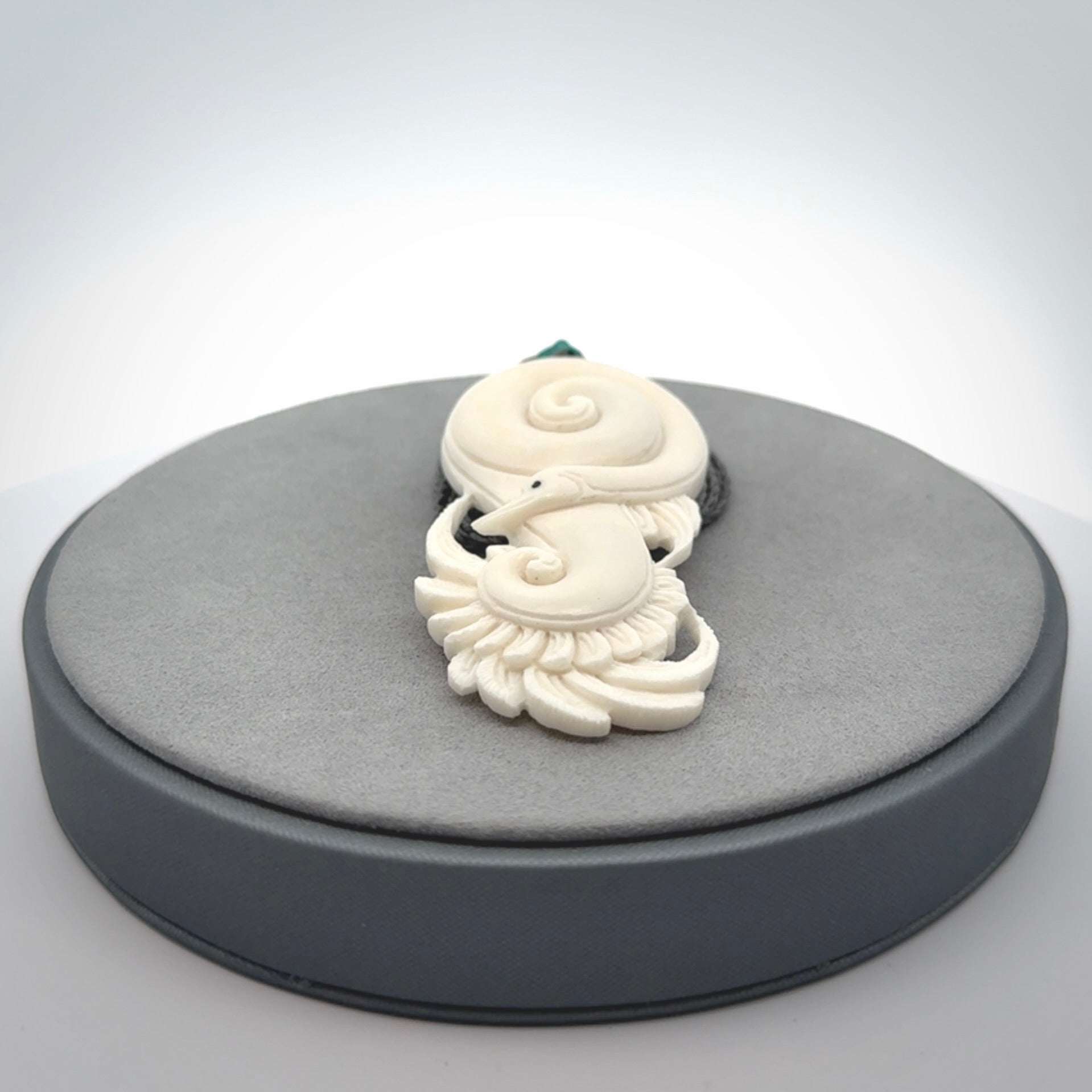 Hand carved bone swan pendant