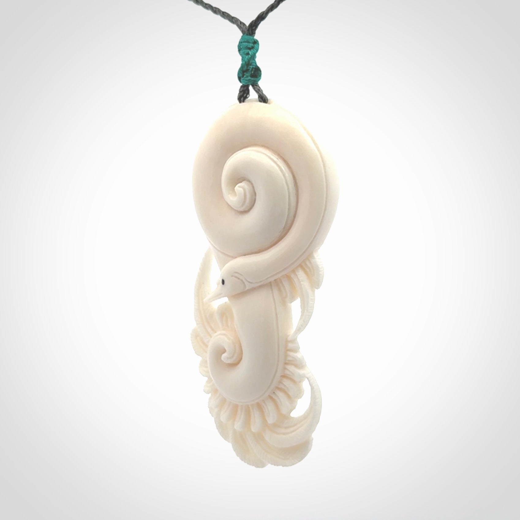 Hand carved bone swan pendant