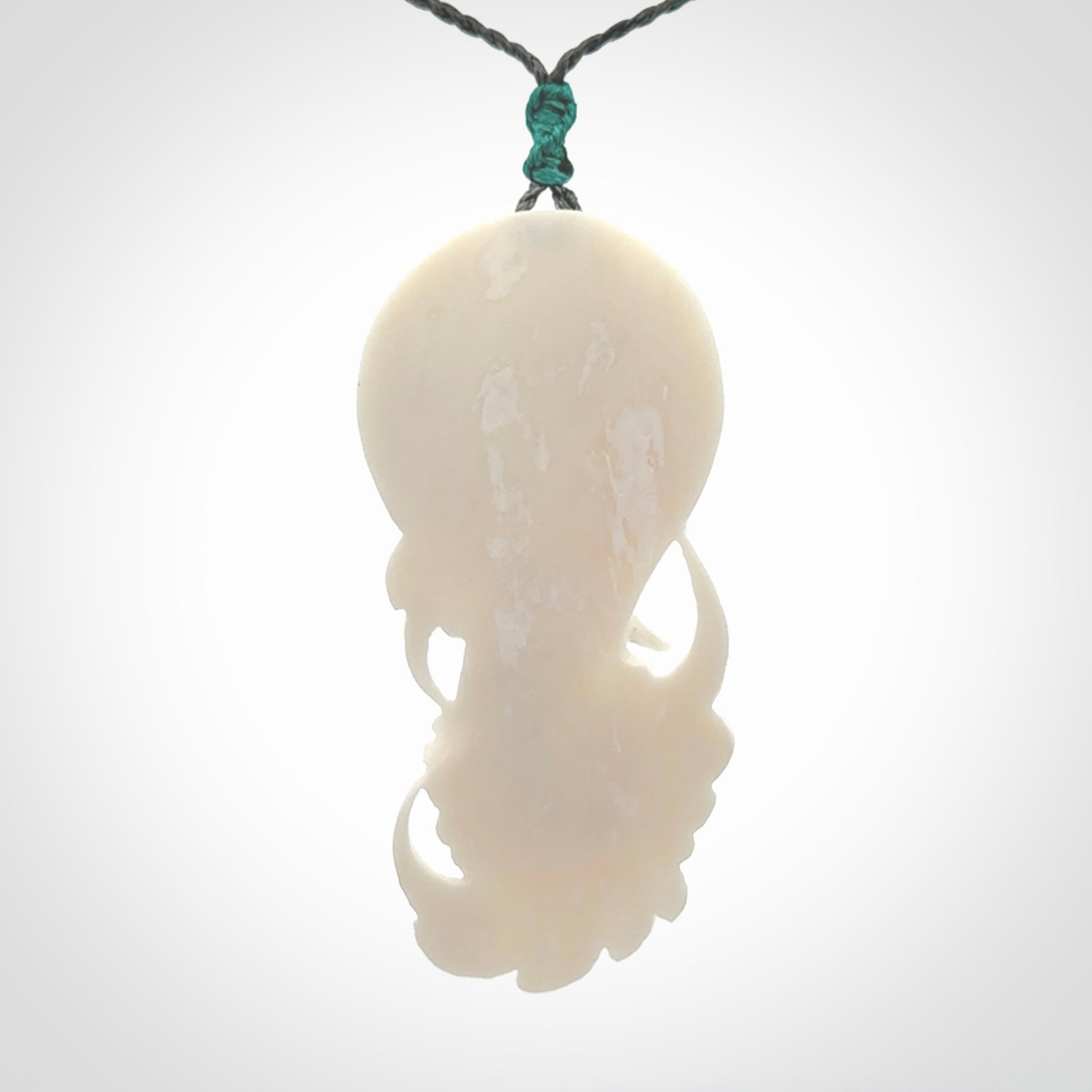 Hand carved bone swan pendant
