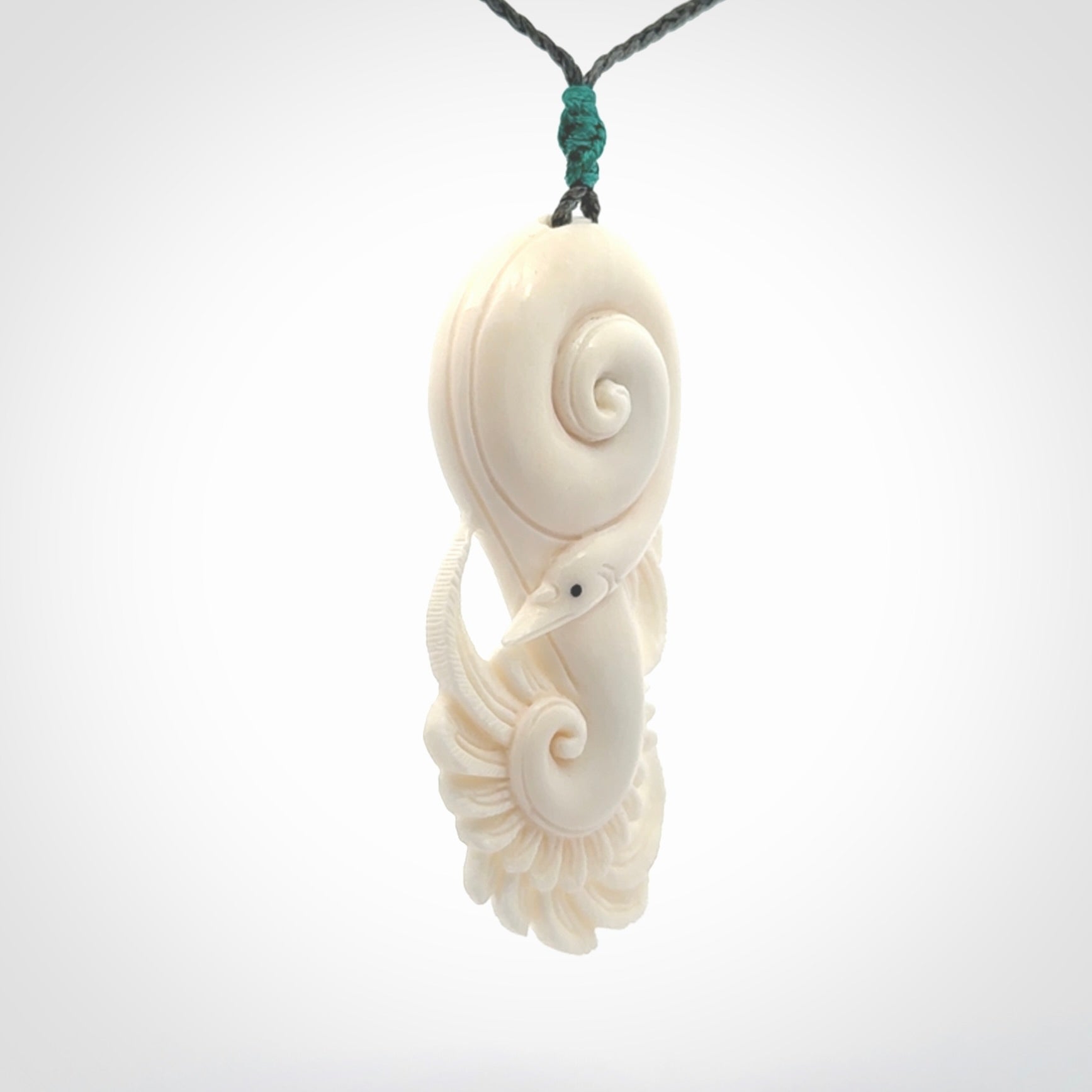 Hand carved bone swan pendant