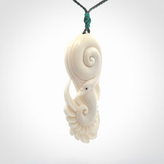 Hand carved bone swan pendant