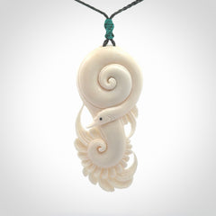 Hand carved bone swan pendant