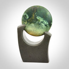 Hand carved New Zealand Marsden Jade Disc with Greywacke stand sculpture. Hand carved here in New Zealand by Ric Moor. This is a 'one only' sculpture, a beautiful display piece.