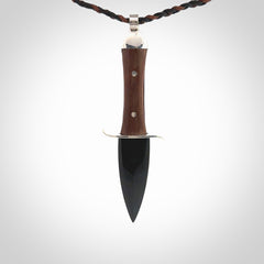 A striking hand carved knife pendant that we've called the blade. These are carved with a jade head and a hardwood handle. The cords are hand plaited in our waxed polyester which is robust, strong and durable. We ship these worldwide with express courier.