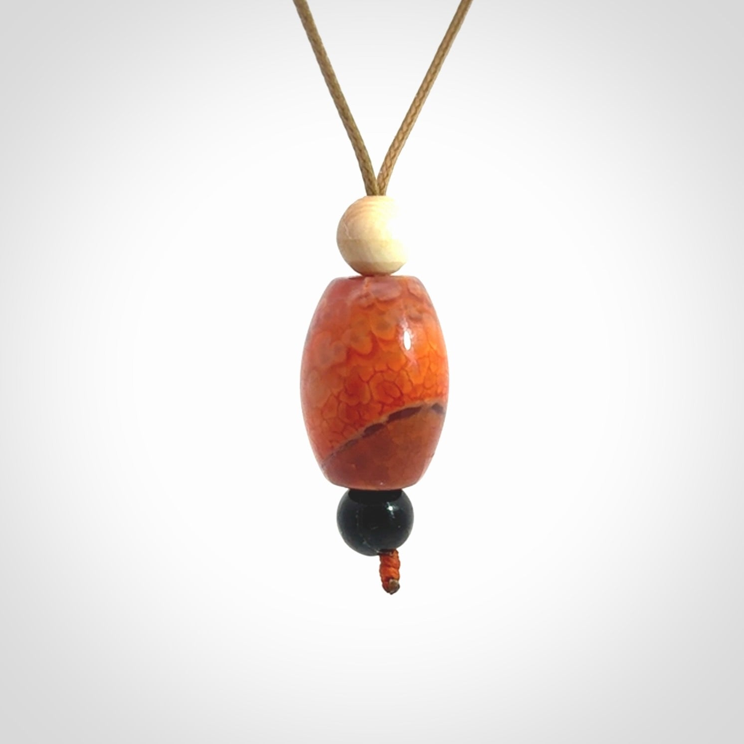 Snakeskin Agate contemporary drop pendant with black jade and woolly mammoth tusk beads. Hand carved for you by NZ Pacific.