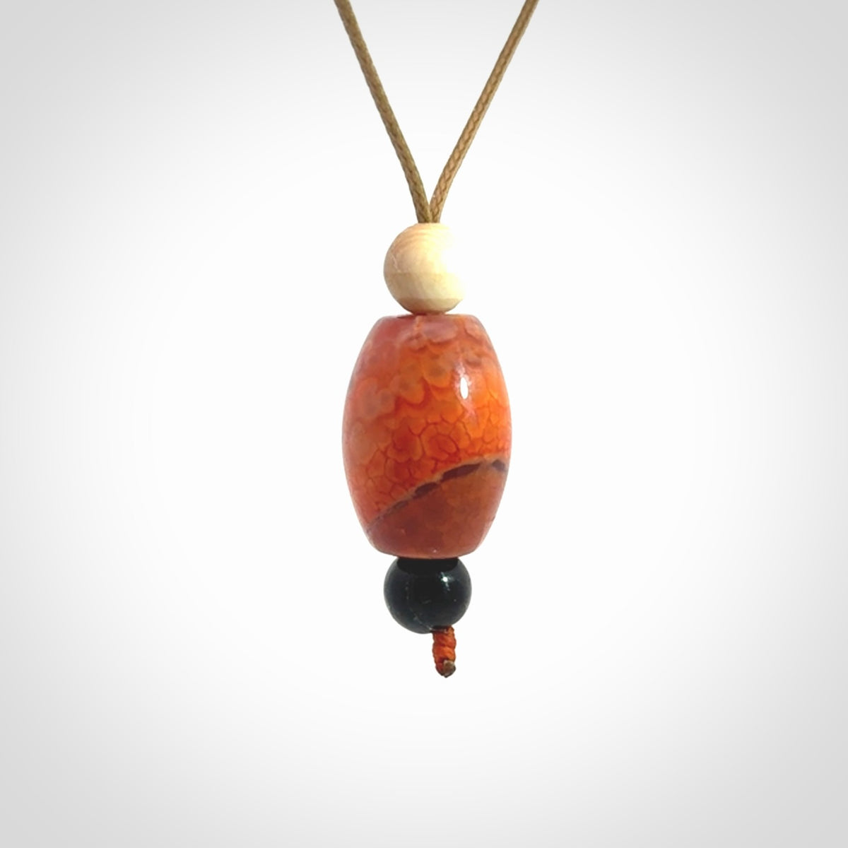 Snakeskin Agate contemporary drop pendant with black jade and woolly mammoth tusk beads. Hand carved for you by NZ Pacific.