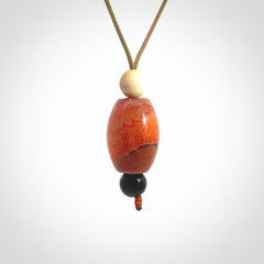 Snakeskin Agate contemporary drop pendant with black jade and woolly mammoth tusk beads. Hand carved for you by NZ Pacific.