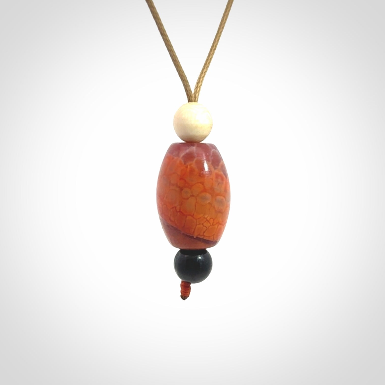 Snakeskin Agate contemporary drop pendant with black jade and woolly mammoth tusk beads. Hand carved for you by NZ Pacific.