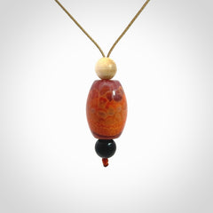 Snakeskin Agate contemporary drop pendant with black jade and woolly mammoth tusk beads. Hand carved for you by NZ Pacific.