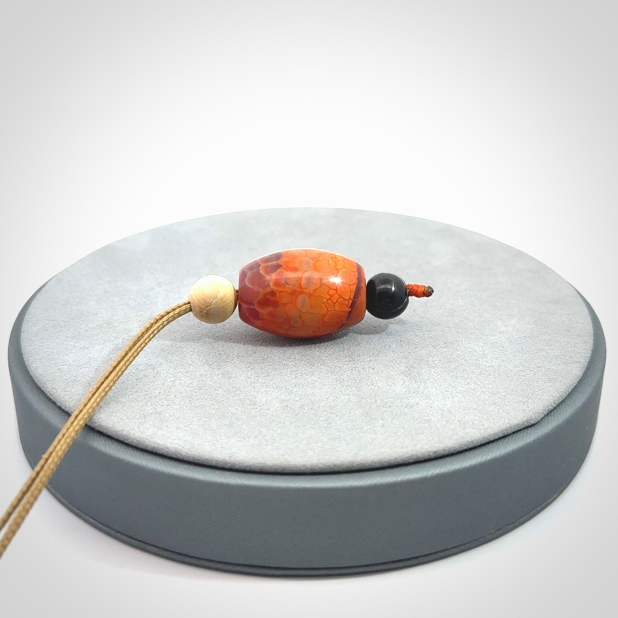 Snakeskin Agate contemporary drop pendant with black jade and woolly mammoth tusk beads. Hand carved for you by NZ Pacific.