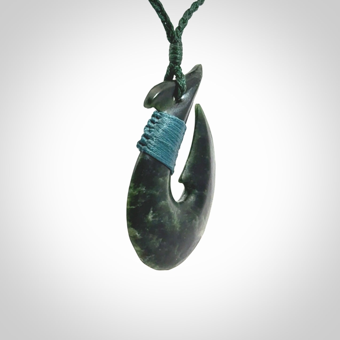 Hand carved New Zealand Jade Hook Pendant. Matau necklace hand carved. Jade Hook pendant provided with adjustable cord and packaged in a woven kete pouch. Delivered with Express Courier.