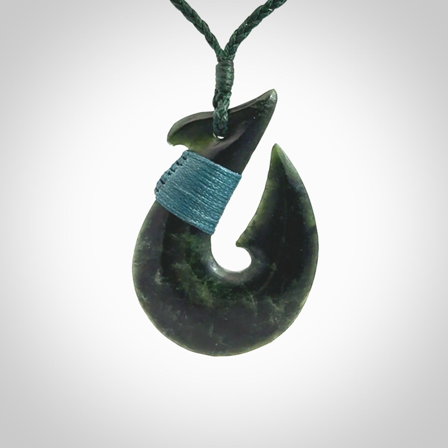 Hand carved New Zealand Jade Hook Pendant. Matau necklace hand carved. Jade Hook pendant provided with adjustable cord and packaged in a woven kete pouch. Delivered with Express Courier.