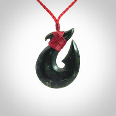 Hand carved New Zealand Jade Hook Pendant. Matau necklace hand carved. Jade Hook pendant provided with adjustable cord and packaged in a woven kete pouch. Delivered with Express Courier.