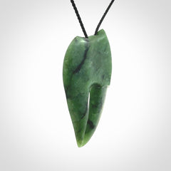 This large crab claw pendant is carved from a lovely deep green piece of New Zealand jade. It has an adjustable black coloured cord which can be slipped over the head and adjusted to the length that you prefer. Hand carved in New Zealand from our local jade by Kyohei Noguchi.