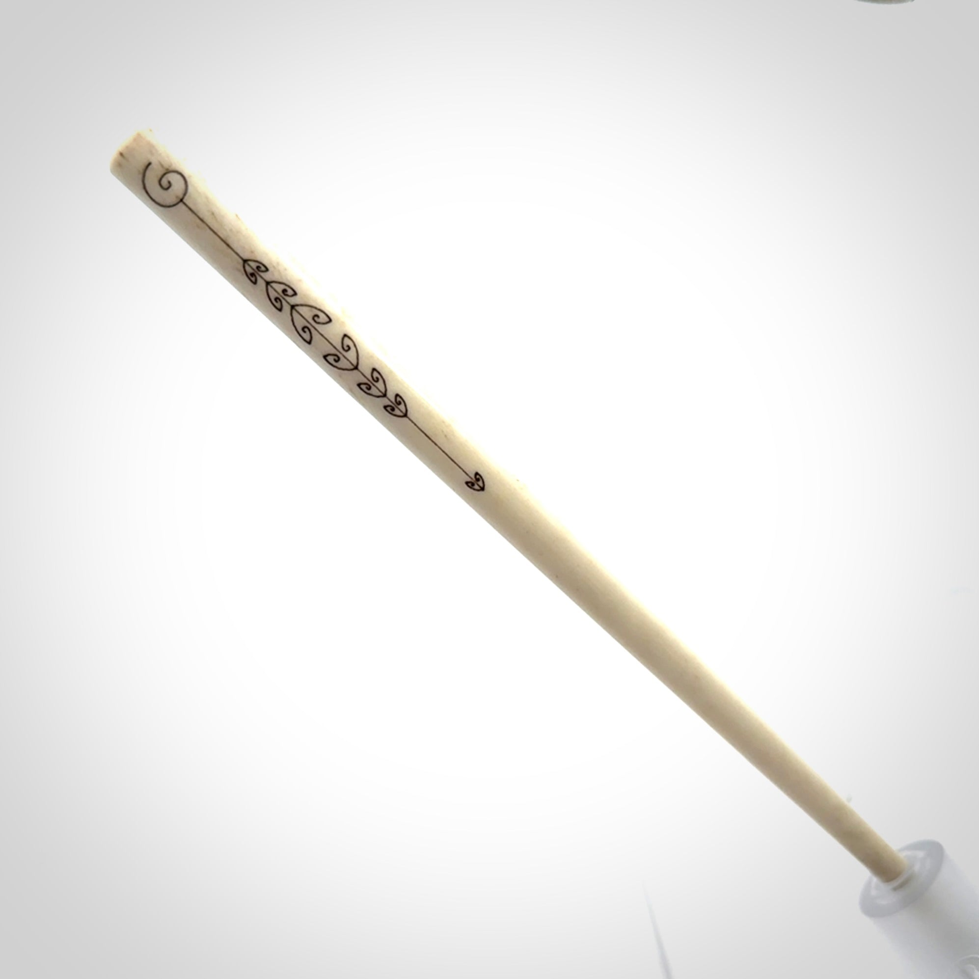 Hand carved bone hair pin with double sided koru design.