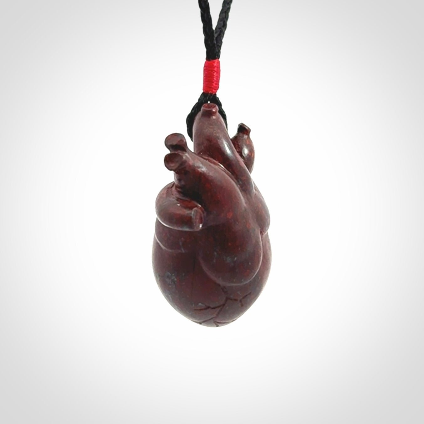 This pendant is handcrafted from Red Jasper Stone. It replicates a human heart. It is supplied with an adjustable black cord.