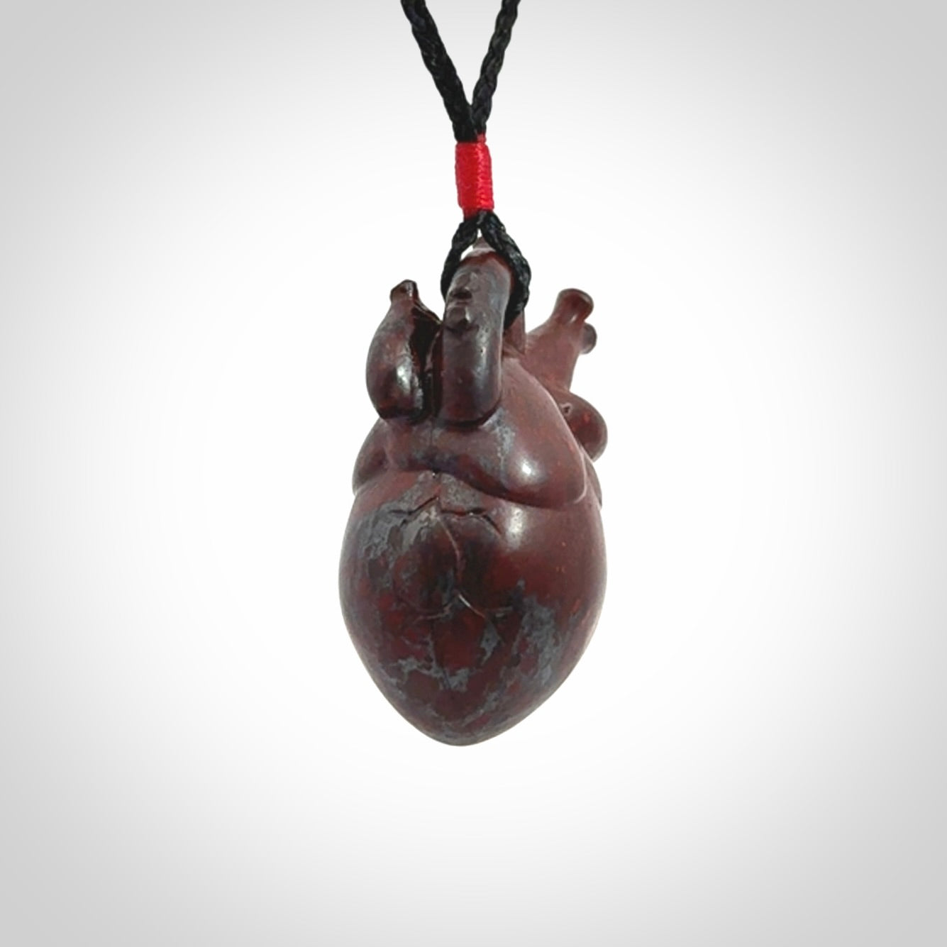This pendant is handcrafted from Red Jasper Stone. It replicates a human heart. It is supplied with an adjustable black cord.
