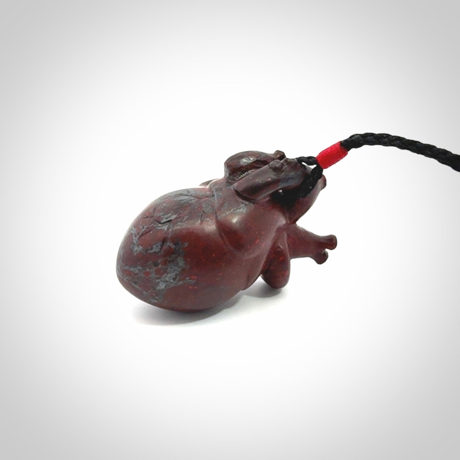 This pendant is handcrafted from Red Jasper Stone. It replicates a human heart. It is supplied with an adjustable black cord.