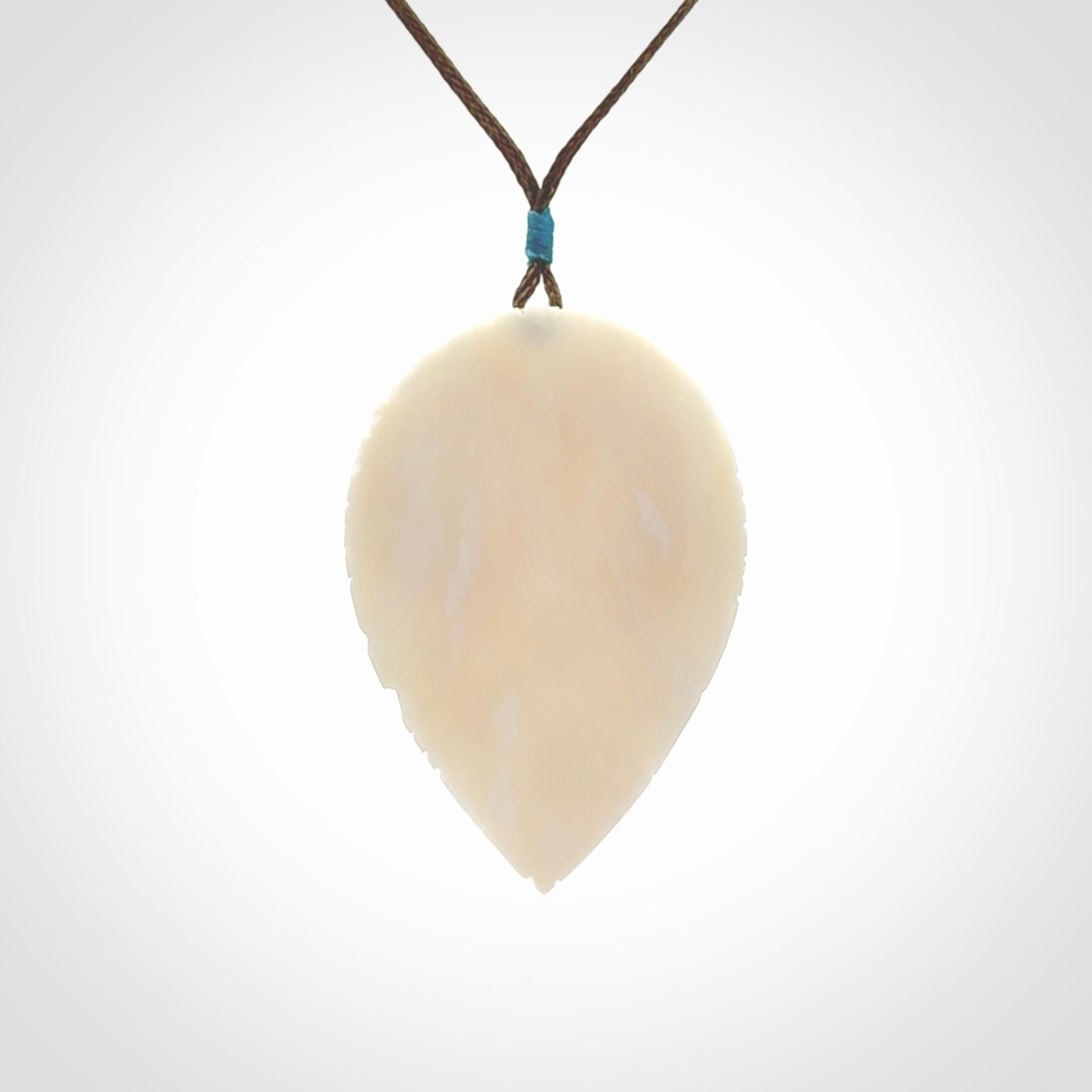 A Owl design carving, hand made for us from Bone. This pendant is provided with an adjustable cord.