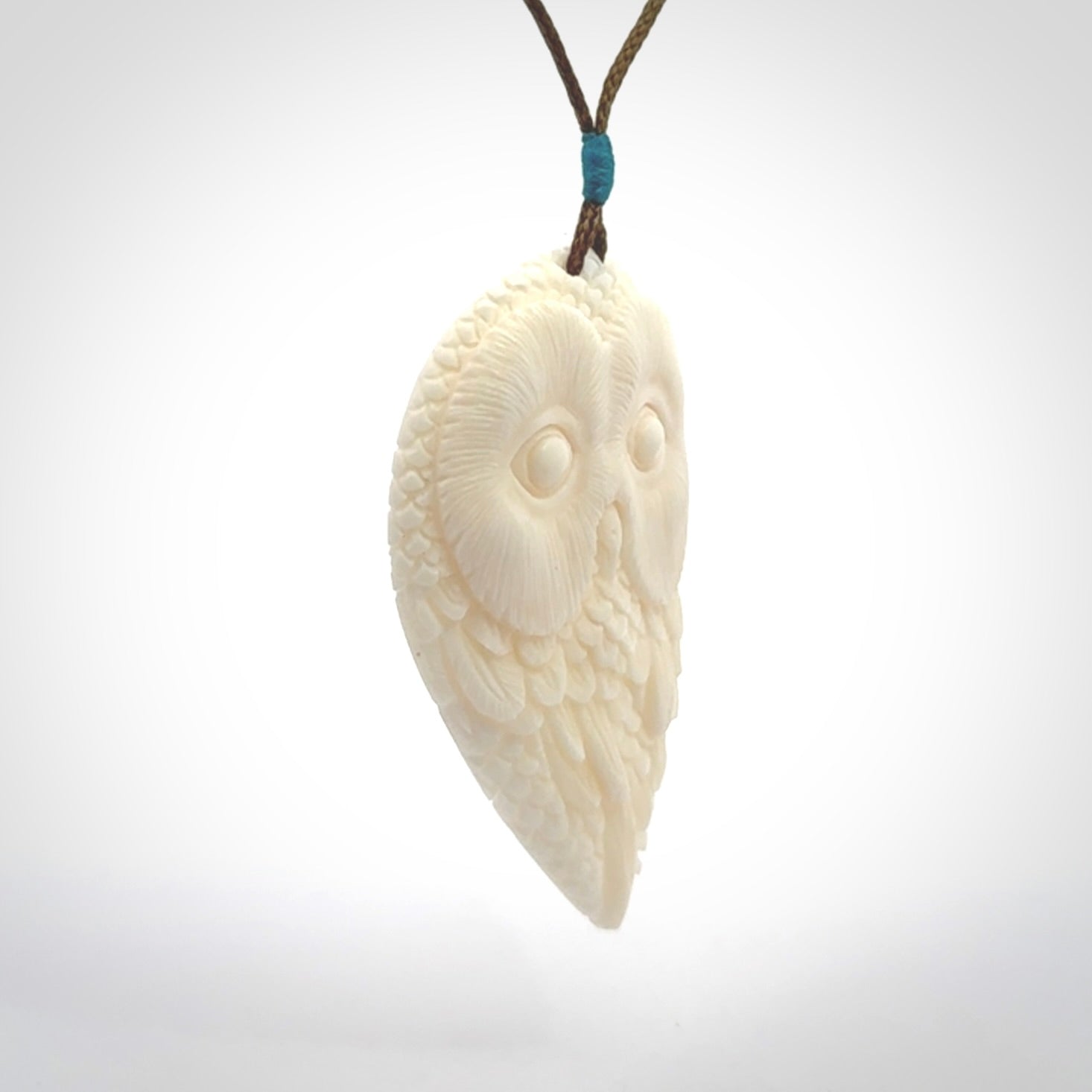A Owl design carving, hand made for us from Bone. This pendant is provided with an adjustable cord.