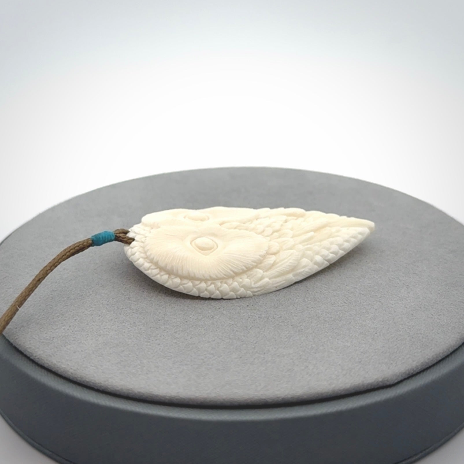 A Owl design carving, hand made for us from Bone. This pendant is provided with an adjustable cord.