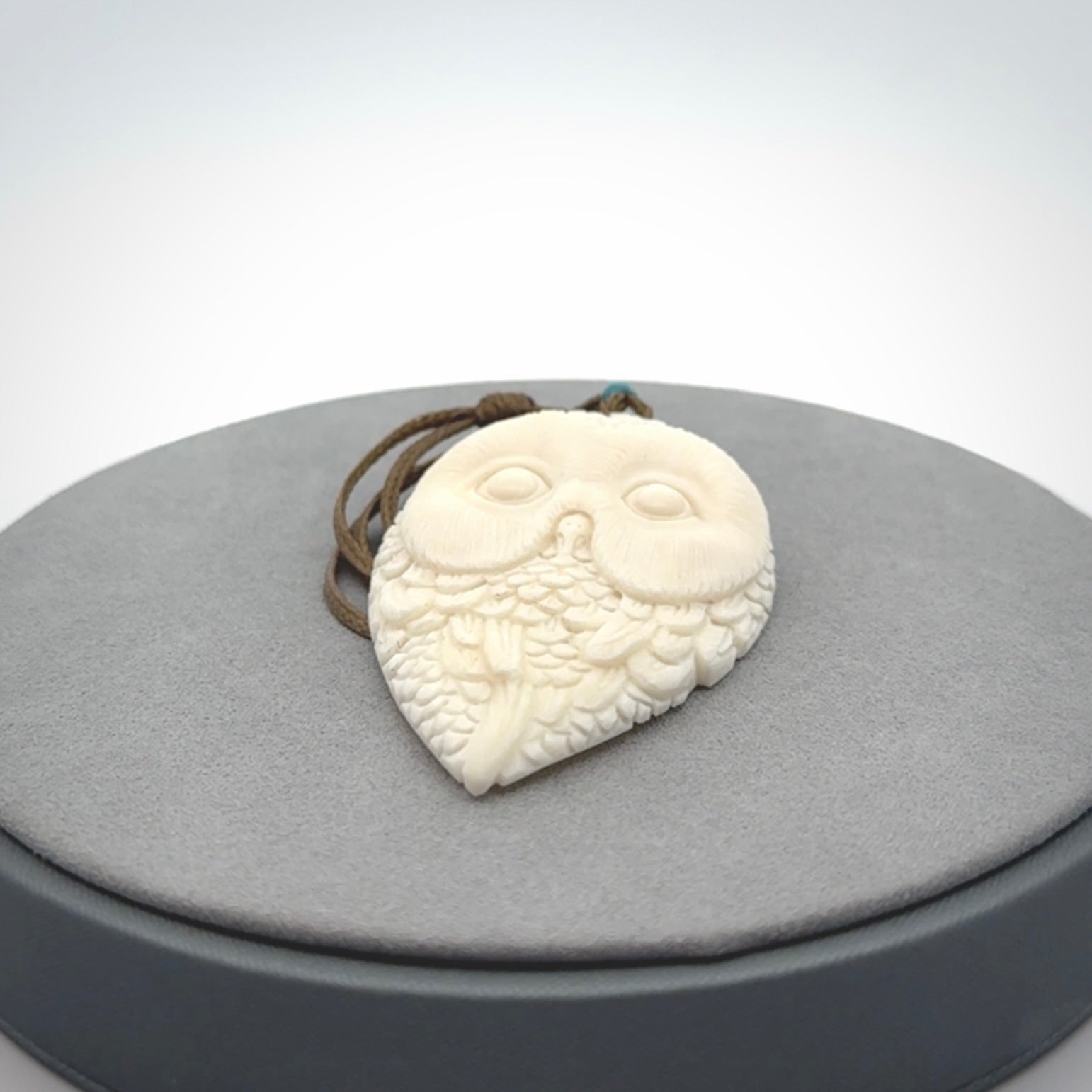 A Owl design carving, hand made for us from Bone. This pendant is provided with an adjustable cord.