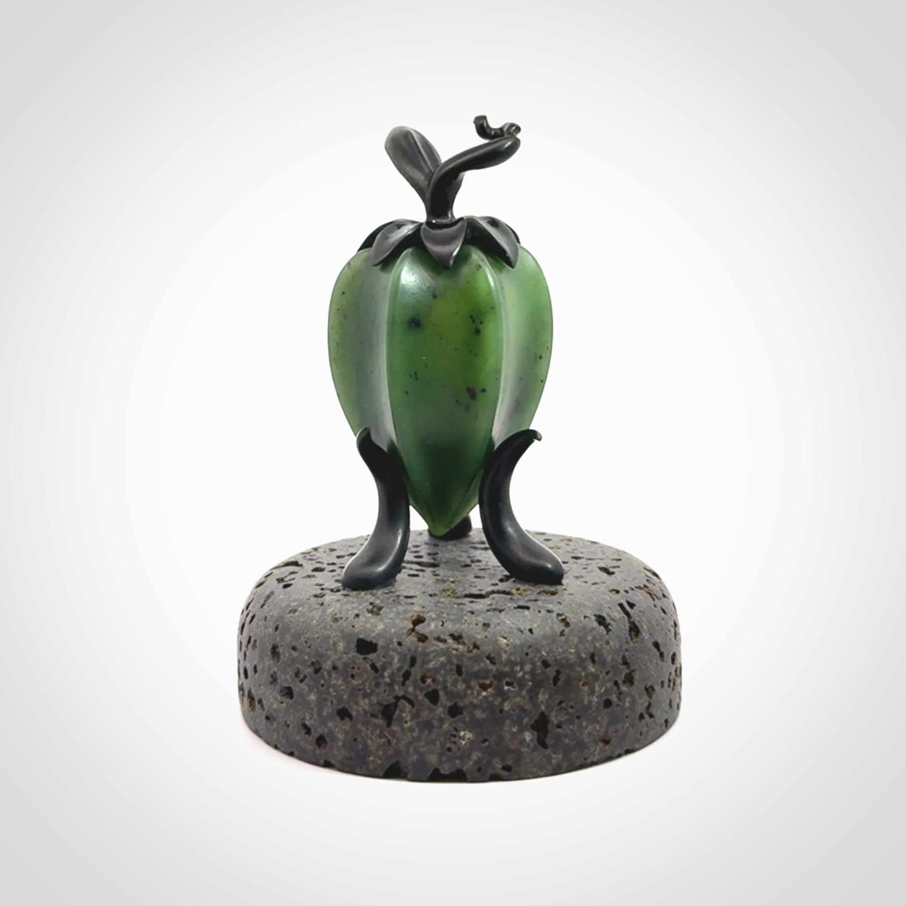 Hand carved Gooseberry sculpture crafted in Black Jade, British Columbian Jade with Basalt stone stand. One only Gooseberry sculpture with lid that encloses a bell.