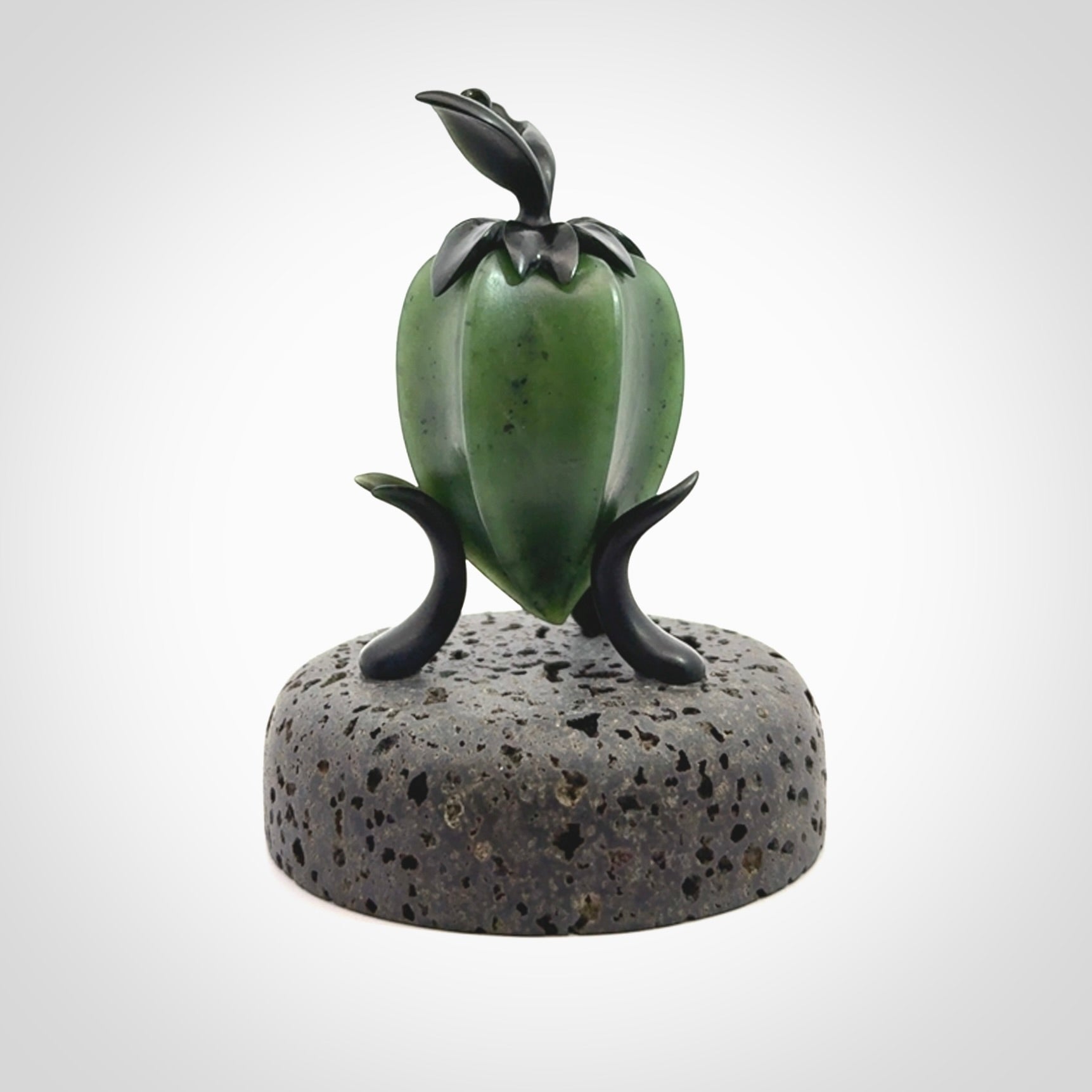 Hand carved Gooseberry sculpture crafted in Black Jade, British Columbian Jade with Basalt stone stand. One only Gooseberry sculpture with lid that encloses a bell.
