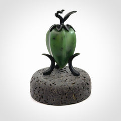 Hand carved Gooseberry sculpture crafted in Black Jade, British Columbian Jade with Basalt stone stand. One only Gooseberry sculpture with lid that encloses a bell.