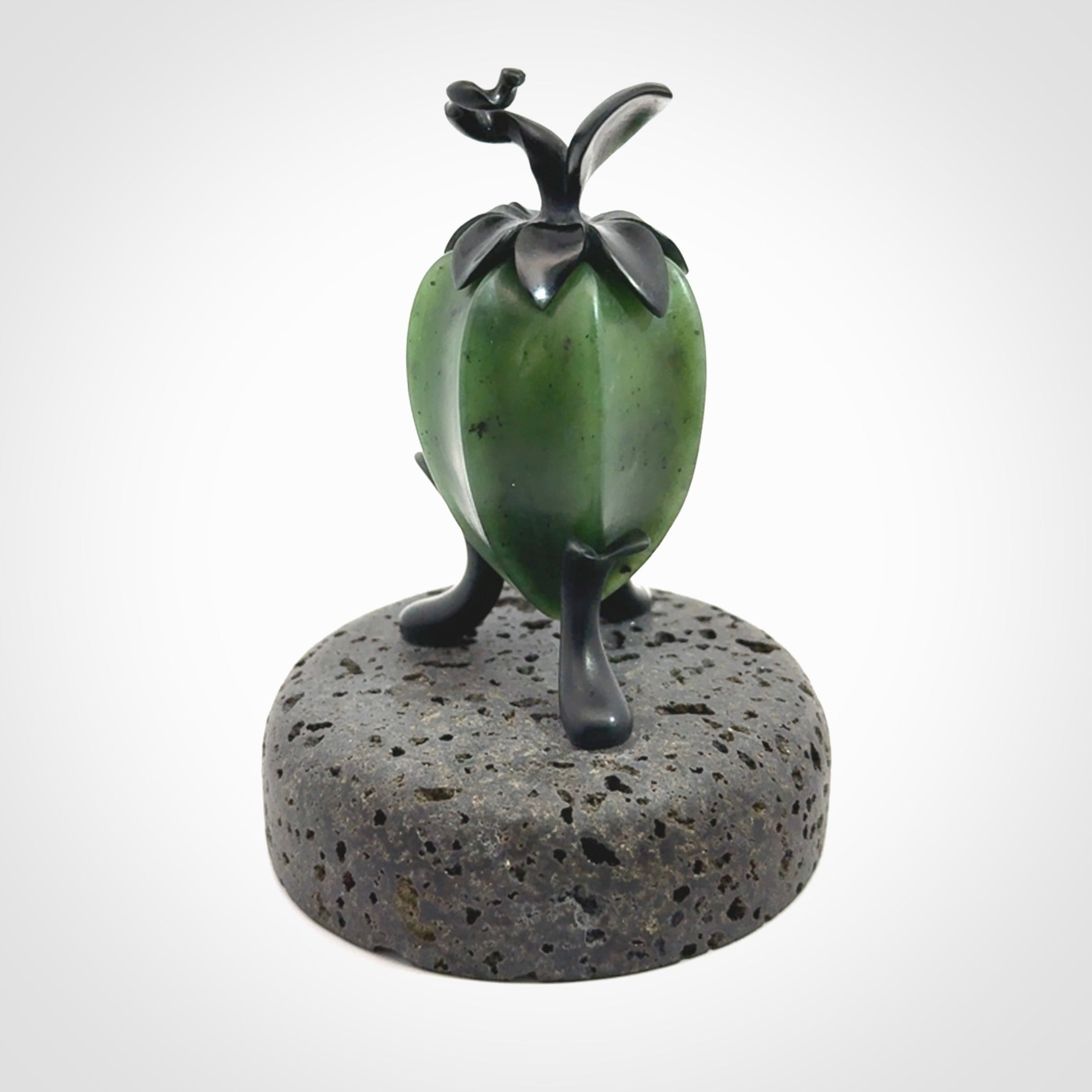 Hand carved Gooseberry sculpture crafted in Black Jade, British Columbian Jade with Basalt stone stand. One only Gooseberry sculpture with lid that encloses a bell.