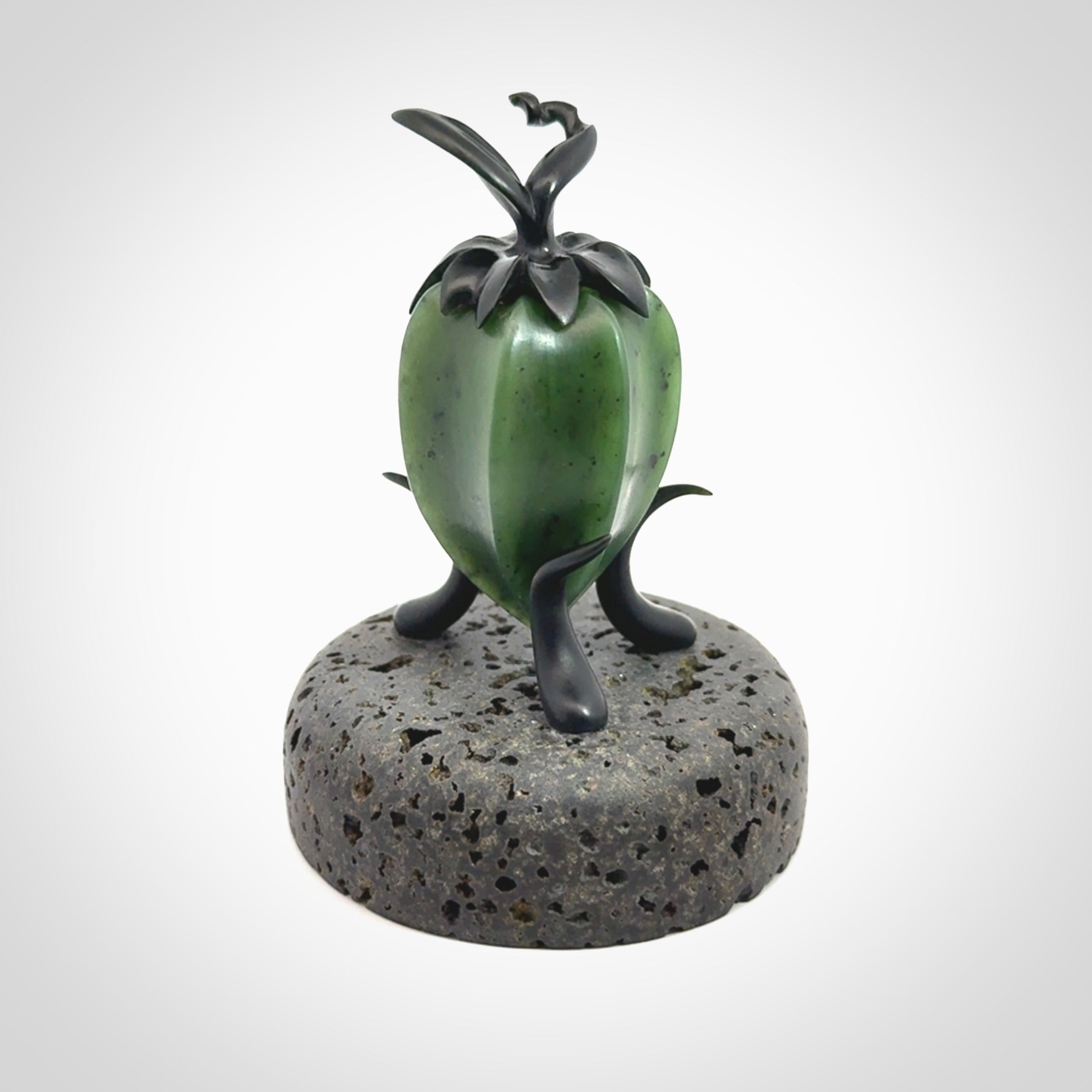 Hand carved Gooseberry sculpture crafted in Black Jade, British Columbian Jade with Basalt stone stand. One only Gooseberry sculpture with lid that encloses a bell.