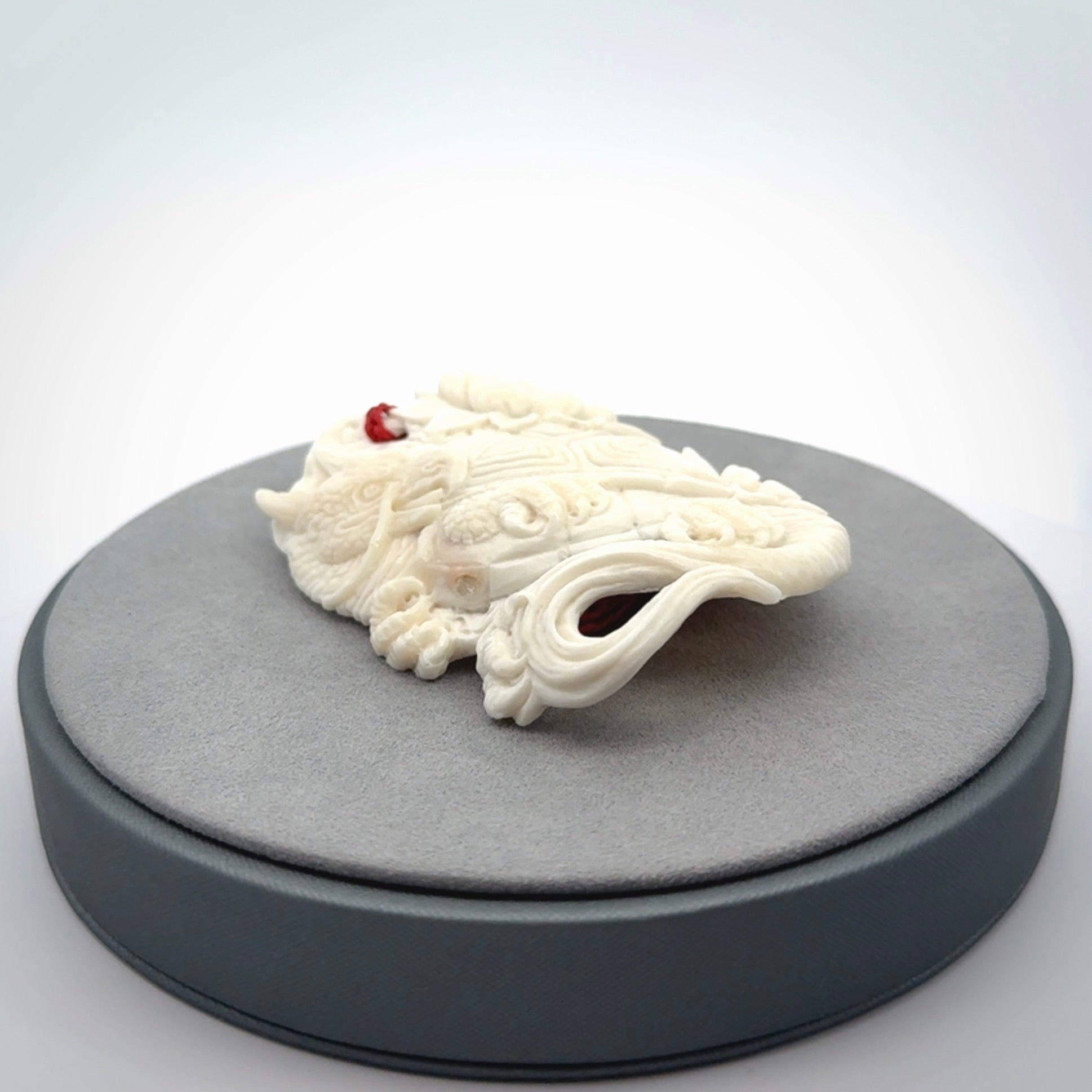 Hand Carved Bone dragon hatchling pendant