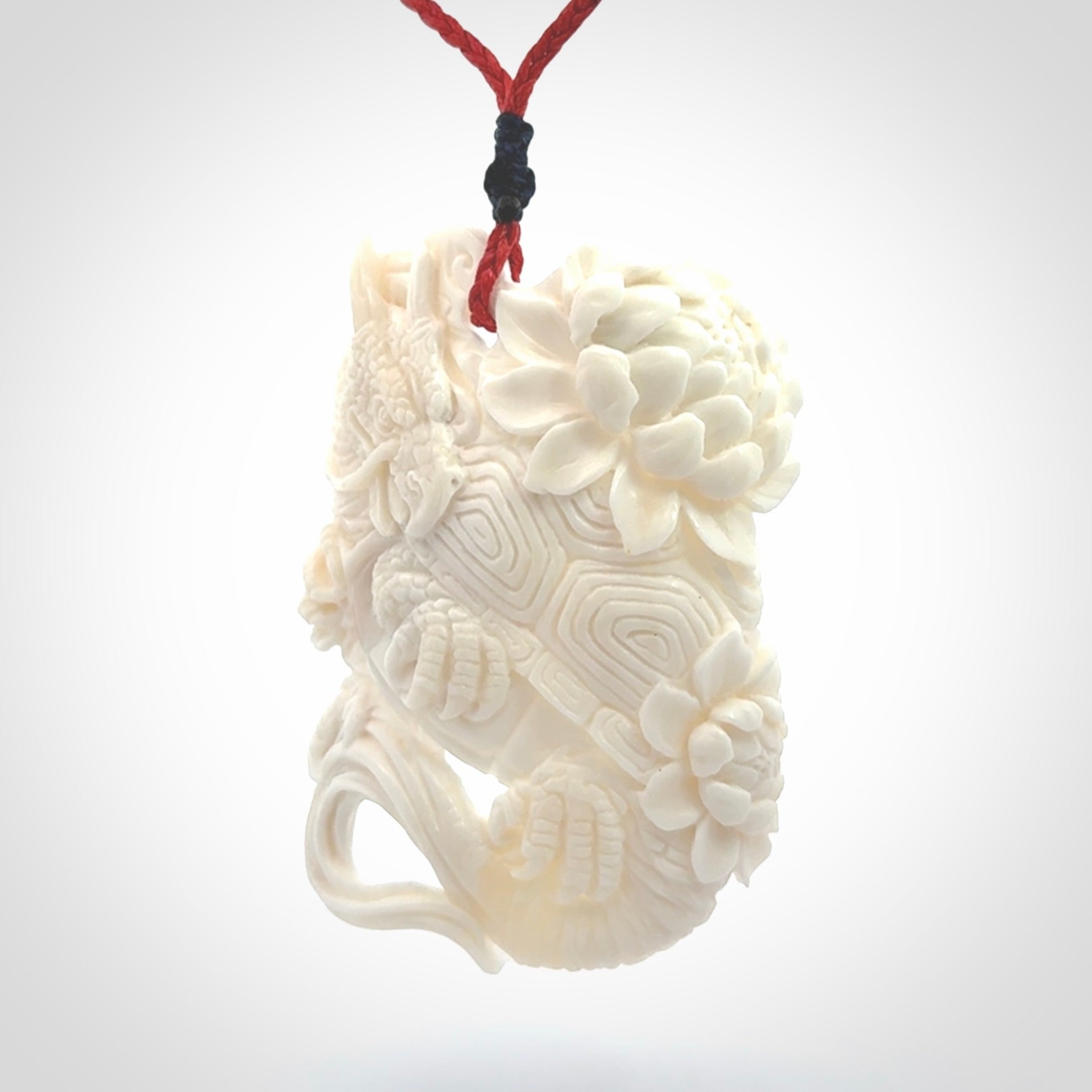 Hand Carved Bone dragon hatchling pendant