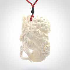 Hand Carved Bone dragon hatchling pendant