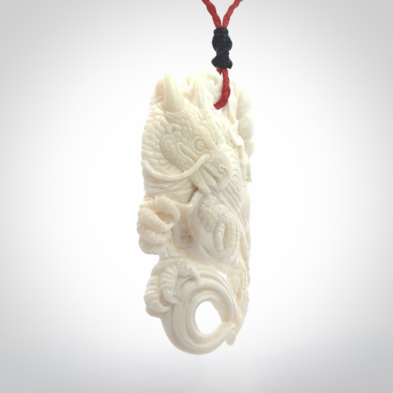 Hand Carved Bone dragon hatchling pendant